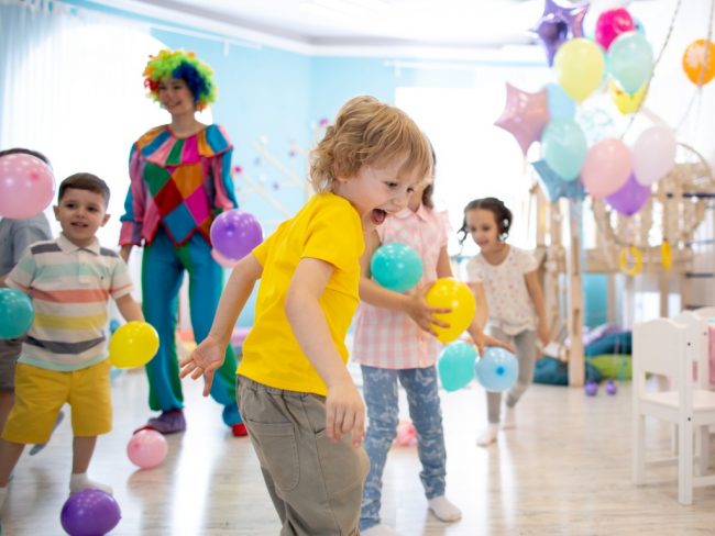 Celebration for kids with clown and balloons