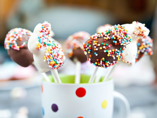 Happy Easter Cake pops ina cupo on greay background, perfect activities for kids